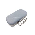 Strasszköves alkalmi táska gyűrűkkel.